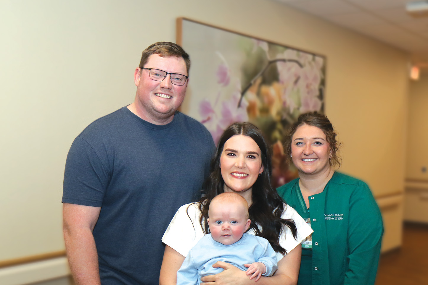 Tim, Samantha and baby Mack Larson with Women's Health registered nurse